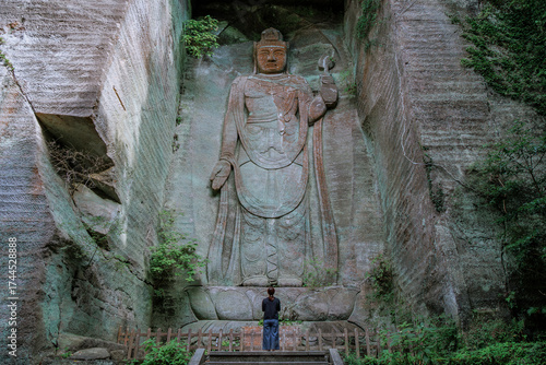 Gazing at Faith: A Soulful Dialogue Before a Kannon Statue.