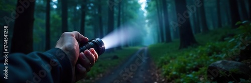 Powerful LED Flashlight Illuminates Mysterious Forest Path at Night - Tactical Grip, Adventure Ready