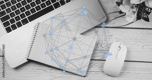 Starting desk view capturing network growing with icons and links over notebook, laptop and mouse