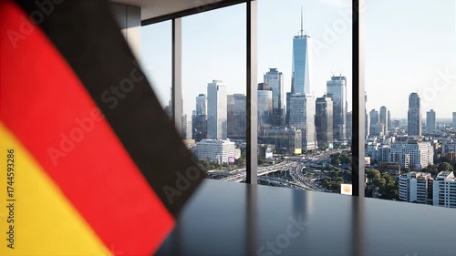 German Flag on Desk with City Skyline View