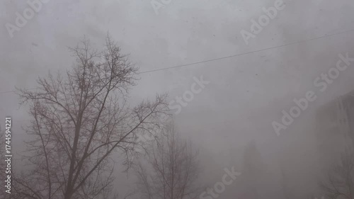 Snow fog from blizzard.Snowstorm outside the window.