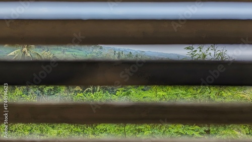 Close-up view reveals a stack of bamboo planks, showing texture and grain.