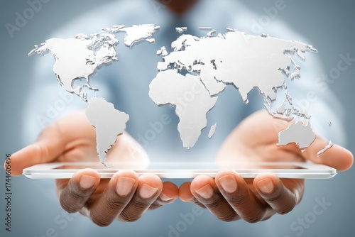 Person holding a transparent tablet projecting a glowing 3D world map, symbolizing global connectivity, digital technology, and international business.