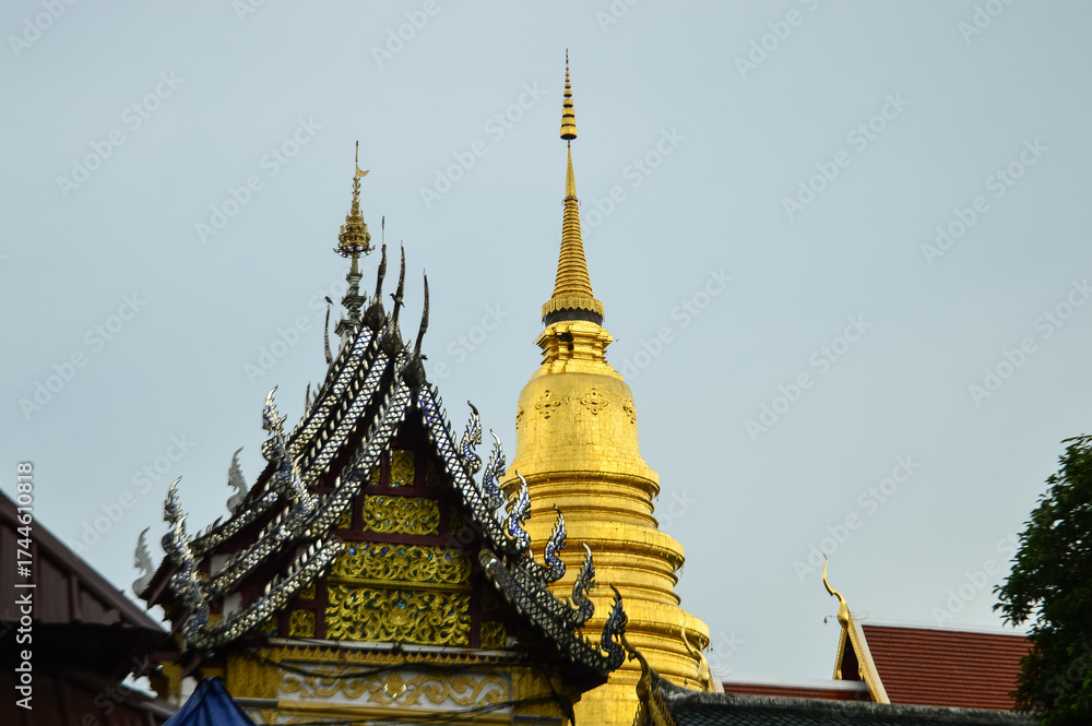 Fototapeta premium Pagoda and Chapel, Lanna Architecture, Symbols of Buddhism, South East Asia at Wat Phra That Hariphunchai, Lamphun, Northern Thailand