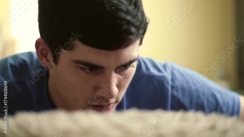 Man deeply focused gazing downwards intently