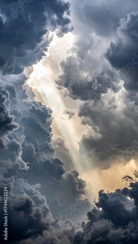 Dramatic sky with dark clouds and a ray of light