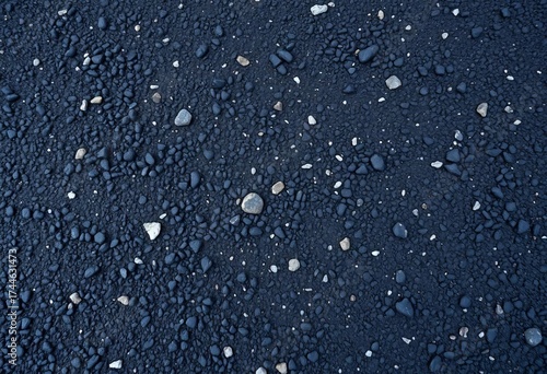 Fototapeta Naklejka Na Ścianę i Meble -  Dark, coarse-grained asphalt surface, showing texture and small stones,  pattern,  uneven