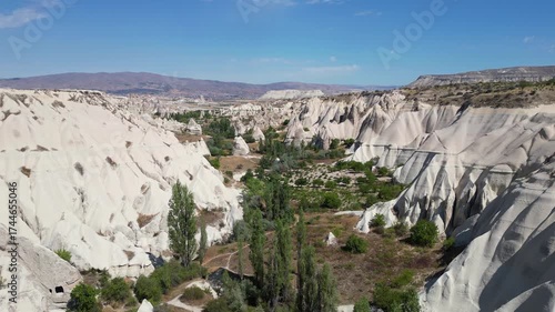 Göreme, Turkey: Footage of a sunny day in Love Valley, Göreme, with views of the mountains in the background and a hiking trail in  the valley