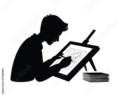 Black silhouette of artist drawing on digital tablet stylus