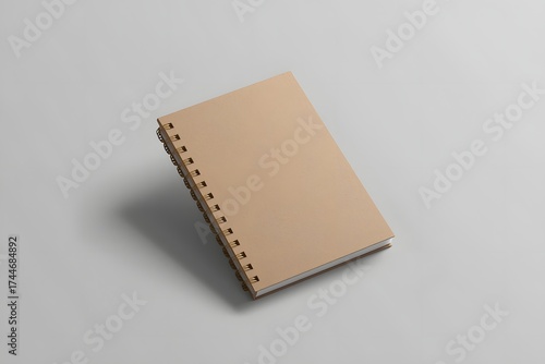 Blank spiral bound notepad mockup template with Kraft Paper cover, isolated on light grey background.