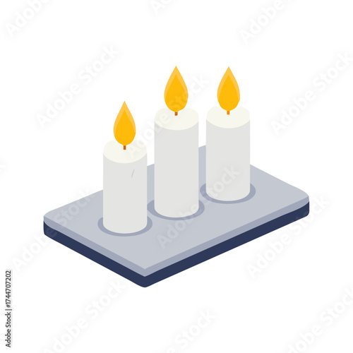 Three lit white pillar candles on a grey rectangular tray