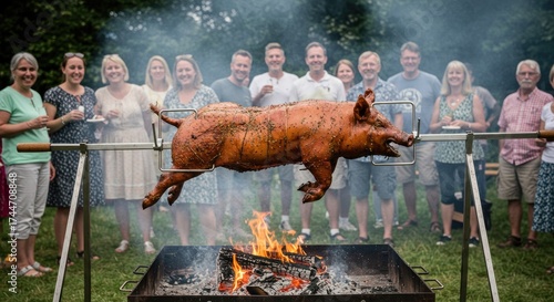 Roasted pig on a spit over fire with a group of people watching