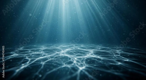 Deep blue ocean waves reflect the sunlight beneath a clear sky on the horizon