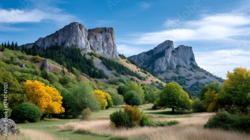 Autumn mountain landscape with rocky cliffs and colorful trees