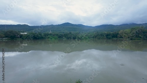 Serene Mountain Lake Reflection Under Overcast Sky