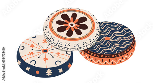 Decorative round coasters with ethnic patterns featuring floral and geometric designs.