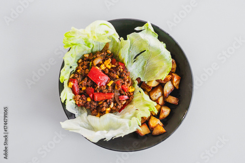 healthy lettuce san choy bow with roasted potato wedges, homemade diabetes friendly meal