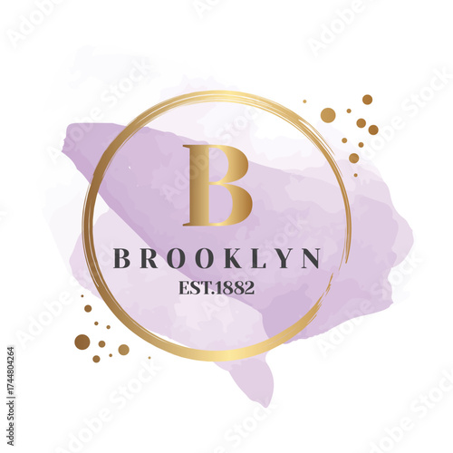 A luxurious logo featuring a gold circular emblem, set against a soft purple watercolor splash