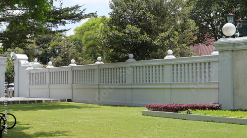 A sturdy and beautiful concrete fence is located in front of the office of the governor of the special region of Yogyakarta.