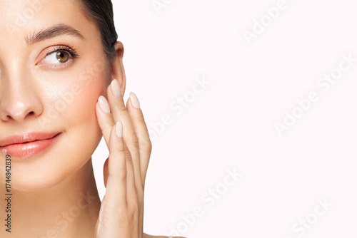 Wallpaper Mural Skin care. Woman with beauty face touching healthy facial skin portrait. Beautiful girl model with natural makeup touching glowing hydrated skin on white background closeup Torontodigital.ca