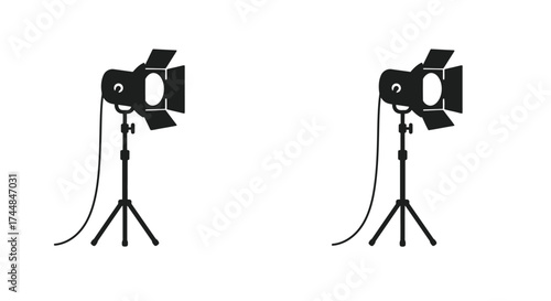 Two black silhouette spotlights on stands a simple graphic design