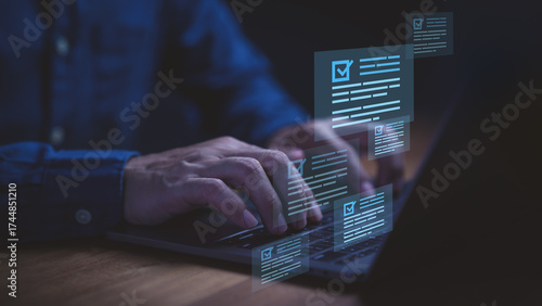Businessman using laptop computer with glowing checklist documents and forms, symbolizing online survey, task management, workflow automation, electronic signature and digital productivity solutions.