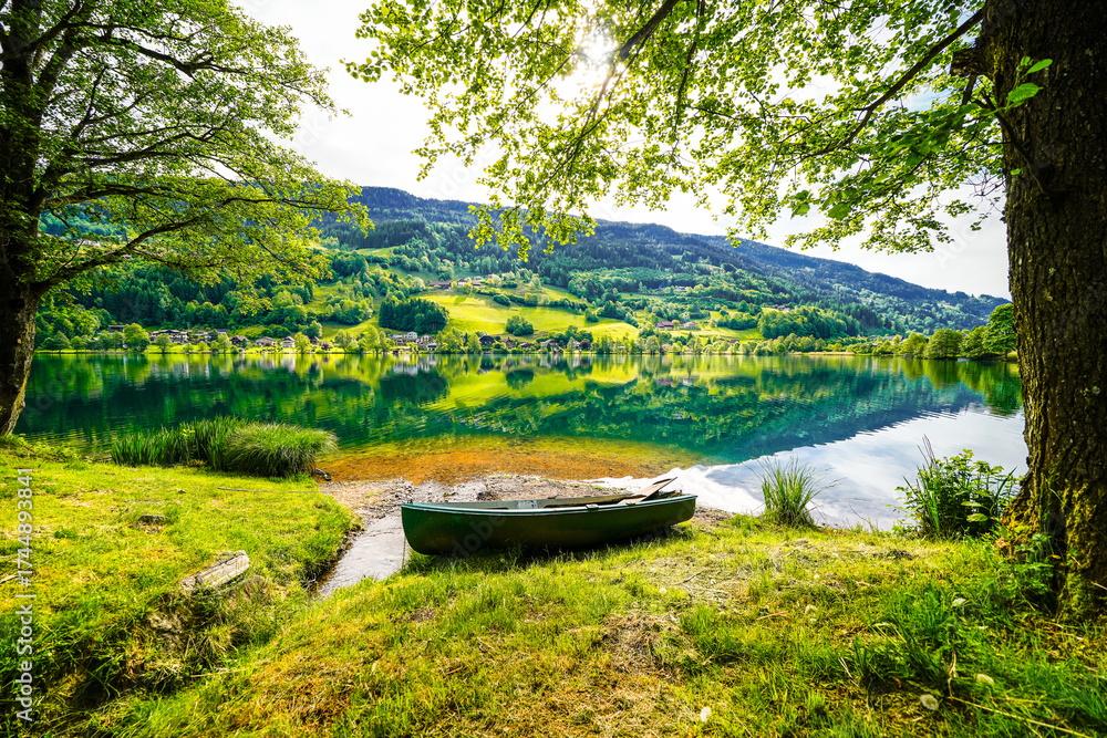 Fototapeta premium Landscape at Lake Feldsee in Carinthia. Nature at an idyllic lake in Austria with mountains in the background. 
