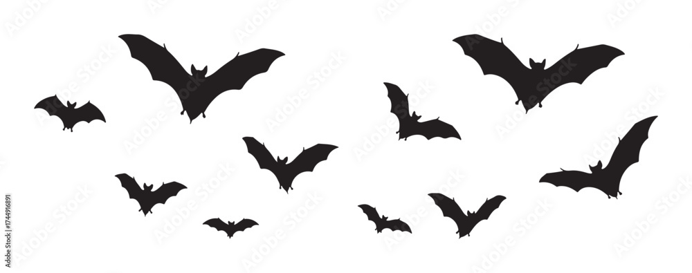 Fototapeta premium Silhouettes of bats flying, creating a spooky and Halloween-themed atmosphere.