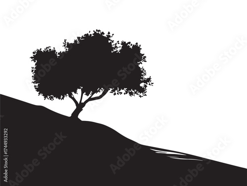 Lone Tree Silhouette on Peaceful Hill with Dramatic Sky