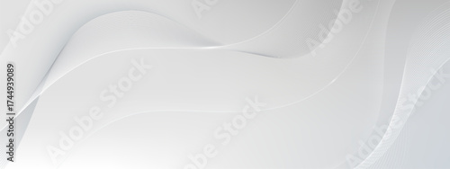 Future white wavy lines with smooth gradient on gray background for modern design or technology concepts. Elegant flowing curves with soft luminous effect. Minimalist abstract motion elements.