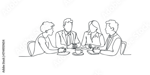Four people in discussion around a table with coffee