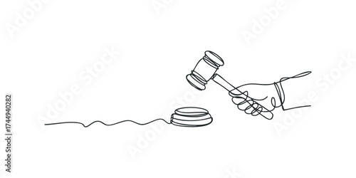 Hand holding gavel over sounding block
