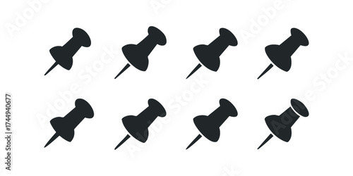 Eight Silhouette Thumbtacks Arranged in Rows