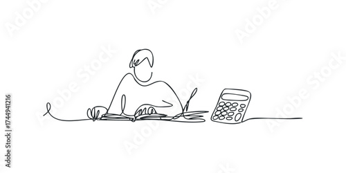 Person studying at a desk with a book and calculator