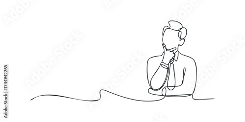 Man in business attire contemplating with hand on chin