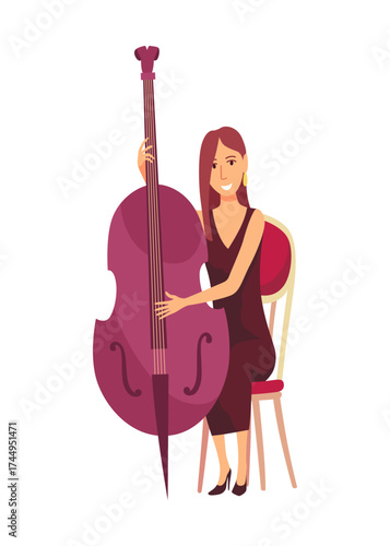 A woman is seated comfortably in a chair, skillfully playing a double bass