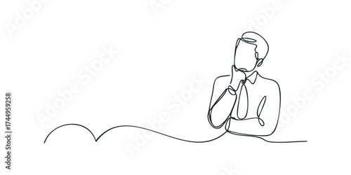 Man in suit thinking with hand on chin