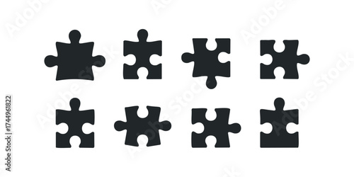 Collection of eight silhouette puzzle pieces on a white background