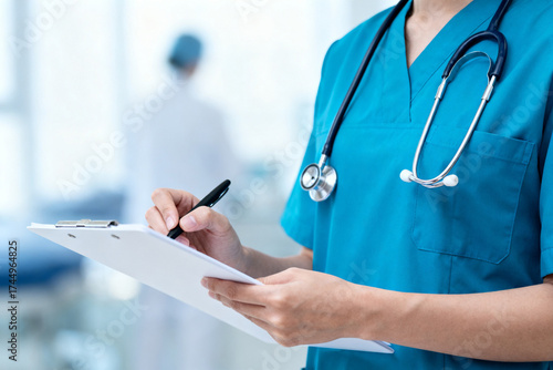 Medical professional writing on clipboard