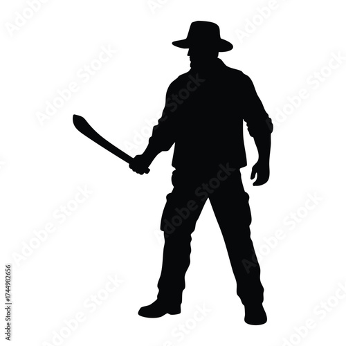 A silhouette of a rugged man in a hat and outdoor clothing, standing ready with a large knife or machete. Represents themes of exploration, danger, survival, and wilderness adventure.