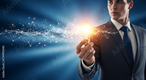 A businessman holds a glowing light bulb with abstract digital connections emanating from it, symbolizing innovation and ideas.