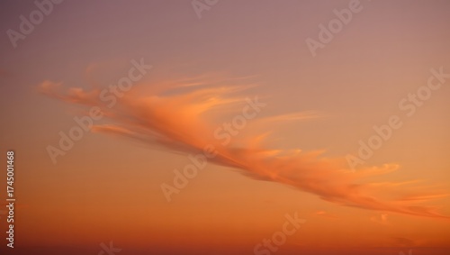 Softly lit cloud formation in a warm sunset sky