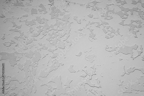 White textured plaster wall with uneven artistic surface and rough patchwork