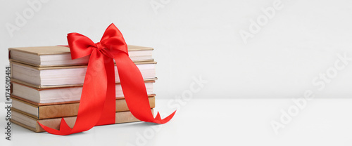 Stack of books tied with ri...