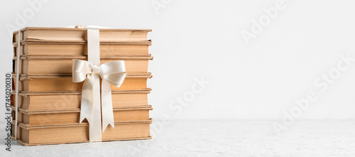 Stack of books tied with ri...