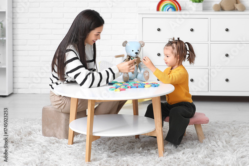 Cute little girl with teach...