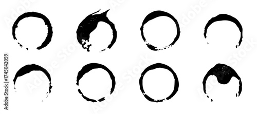 Vector set of grunge ink rings. Hand-drawn coffee cup stains with rough texture. Perfect for vintage, urban, and decorative design elements.