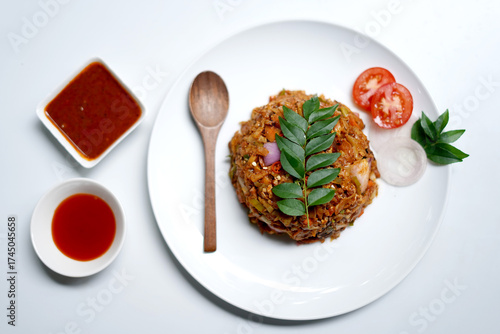 Spicy Chicken Kottu Roti Served on White Plate.