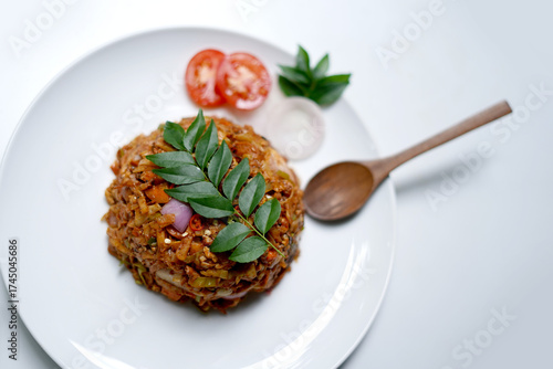 Sri Lankan Egg and Vegetable Kottu Roti on White Background. food photography