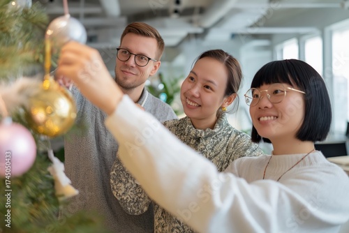 Happy Office Team Decorating Christmas Tree Together